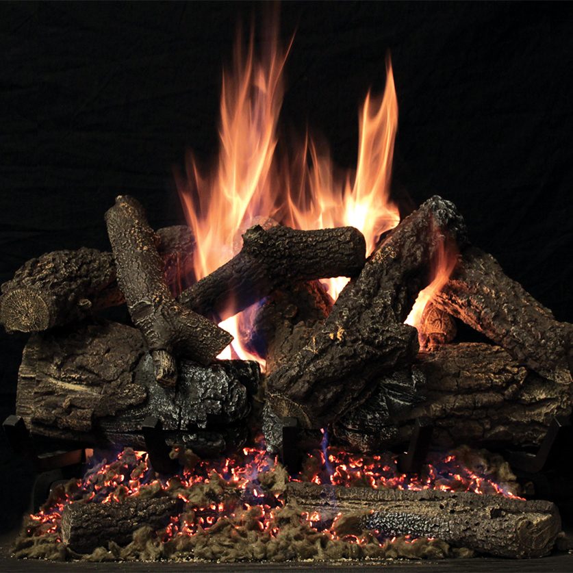 A White Mountain Hearth gas log set burning over a glowing ember bed