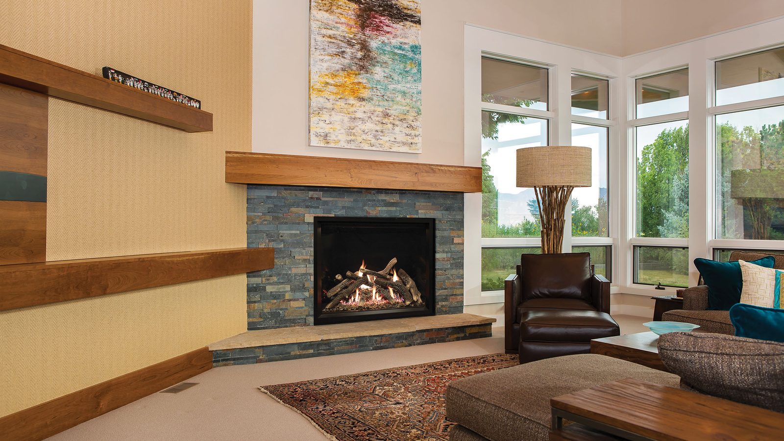 A White Mountain Hearth direct-vent gas fireplace in a stacked stone surround
